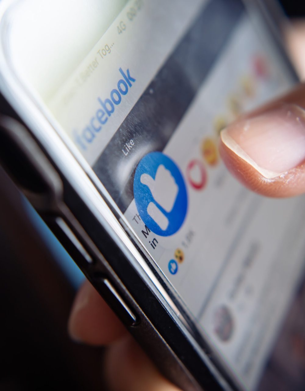 Bangkok Thailand – January 10 2021 Facebook user touches on the like button in Facebook app #image_title